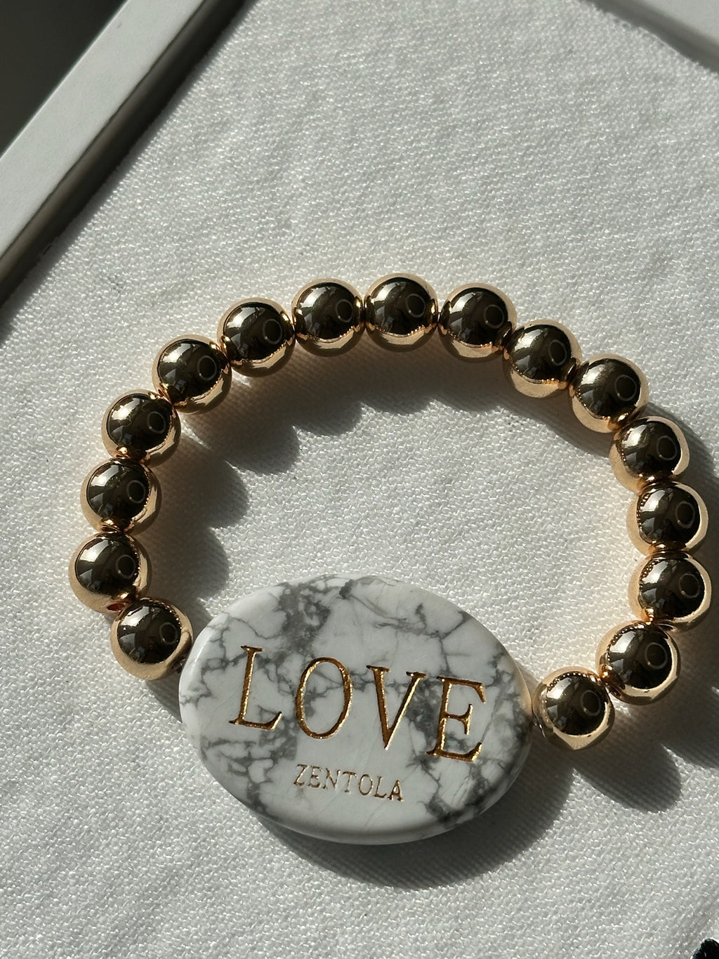 Howlite with Gold Hematite Band